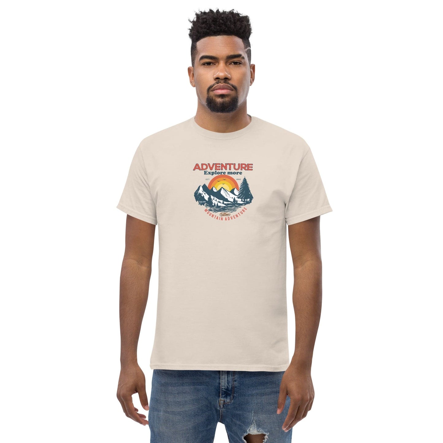 Beige t-shirt with mountain graphic.